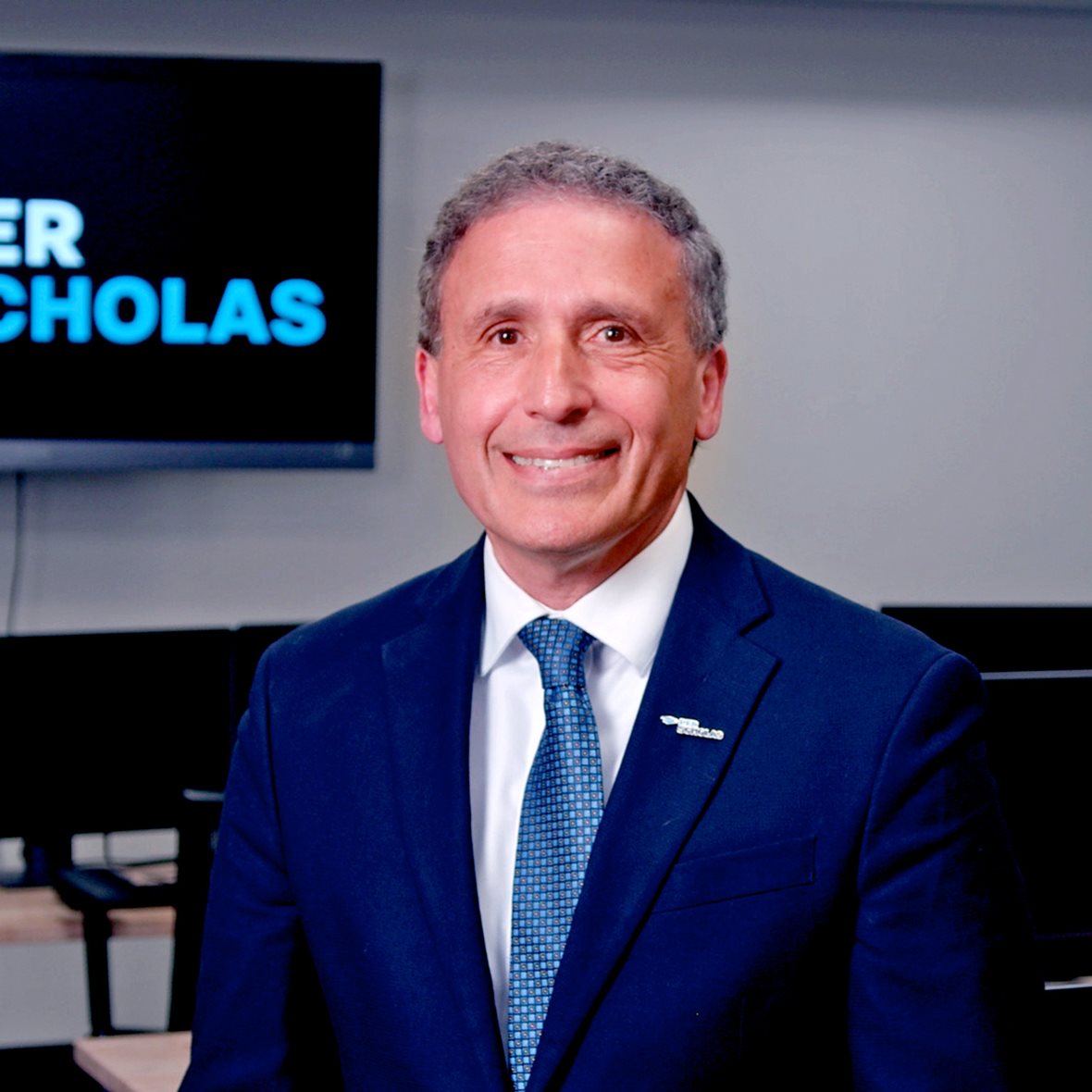 A headshot of Plinio Ayala, CEO of Per Scholas.
